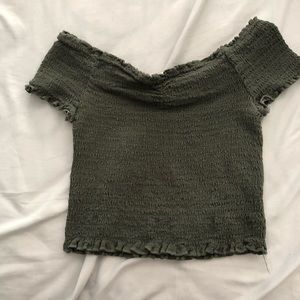 cropped fitting green off the shoulder shirt